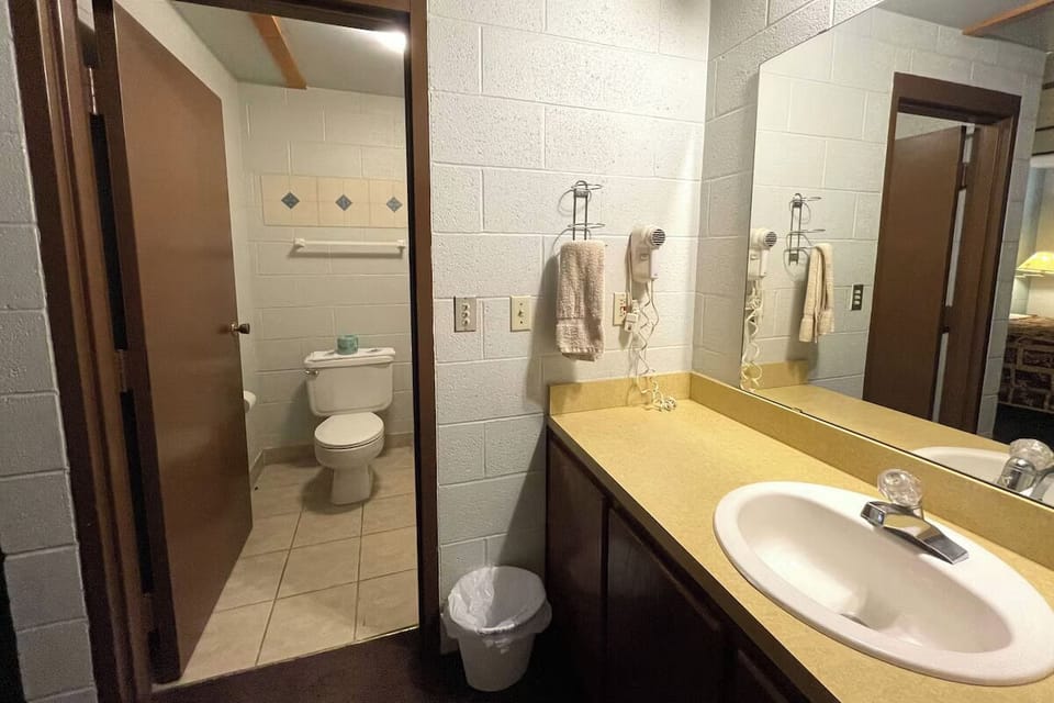 Refresh easily with a wide vanity and bright mirror lighting.