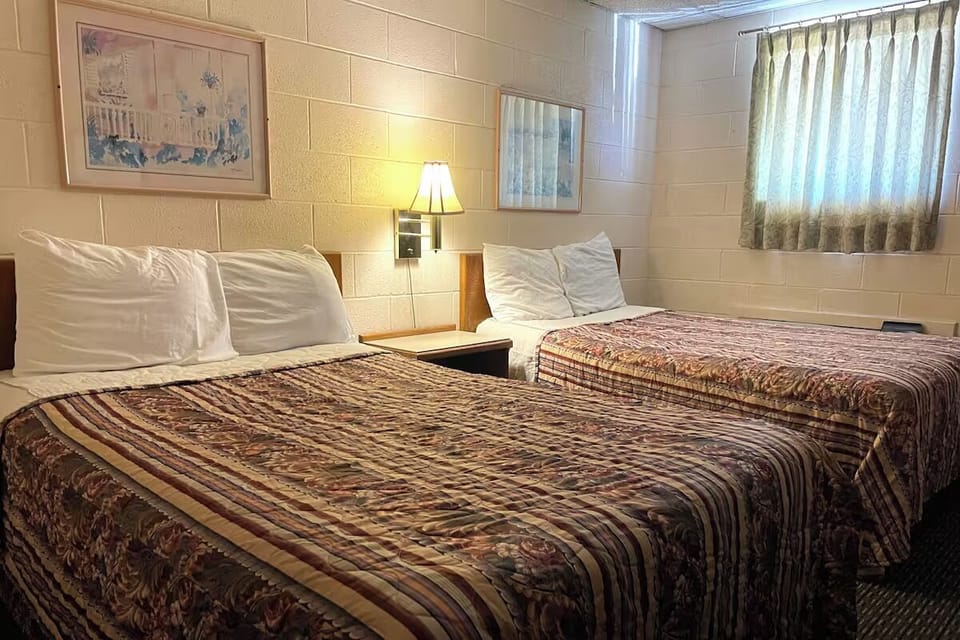 Stretch out comfortably with two beds and soft bedside lighting.
