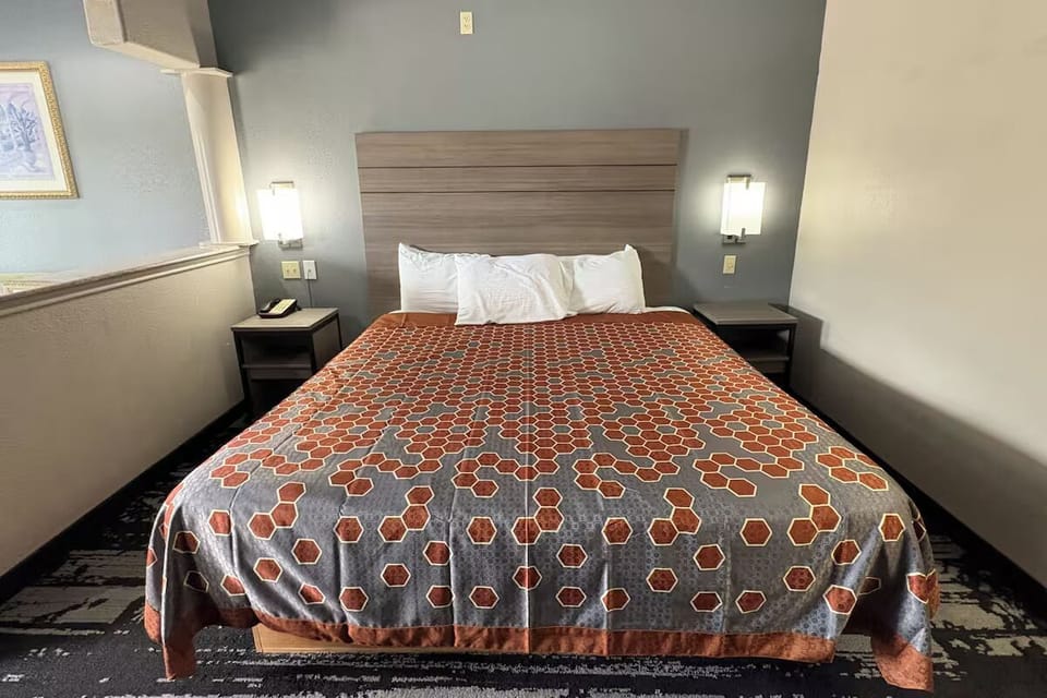 Sink into a comfortable king bed under warm bedside lights.