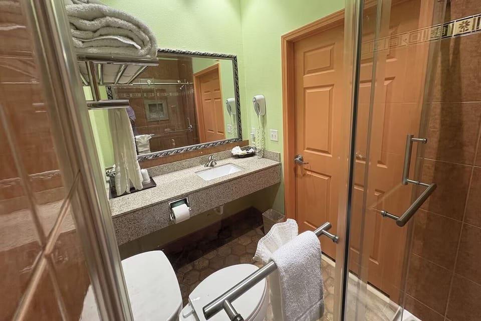 Refresh at the bright vanity with plush towels ready.