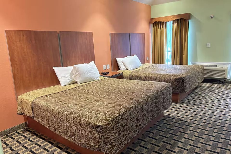 Unwind together in twin beds with fresh linens and space.
