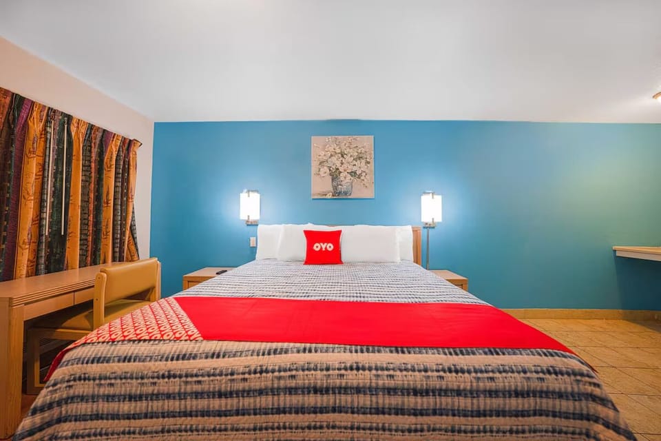 Sink into crisp linens beneath warm bedside lighting.