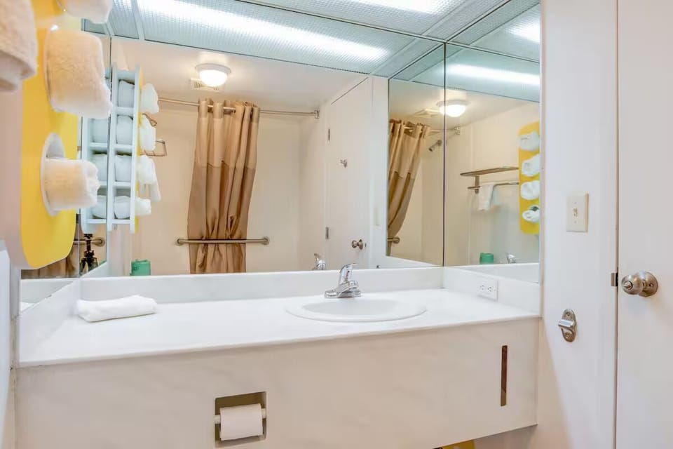 Get ready with expansive mirrors and a clean, spacious counter.