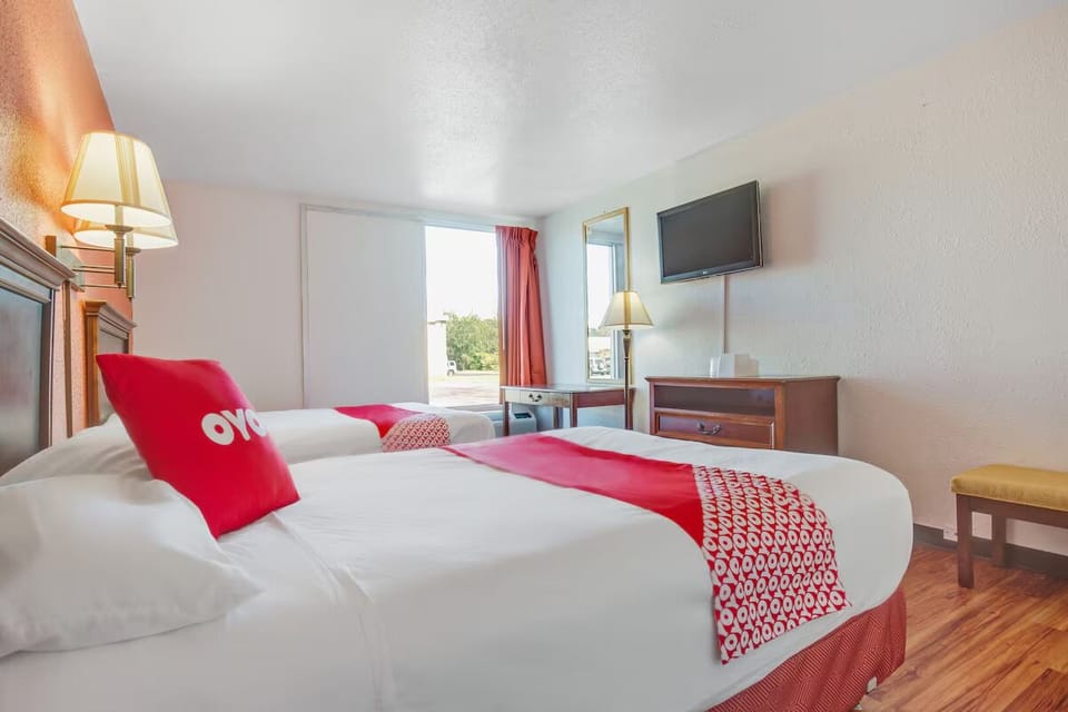 Unwind in crisp linens with sunny window views and TV.