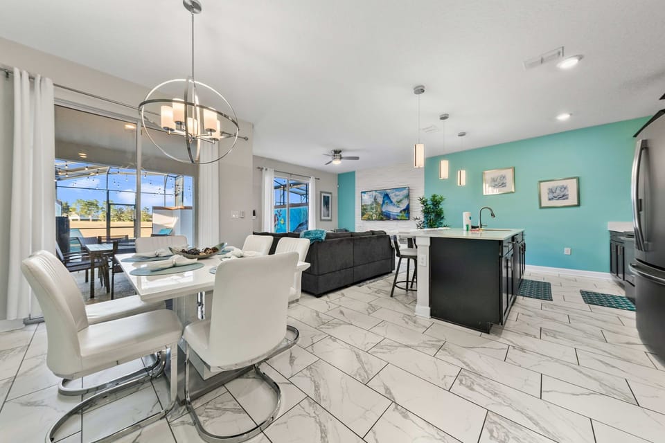 Open-concept living, dining, and kitchen area designed for gathering, relaxing, and spending time together.