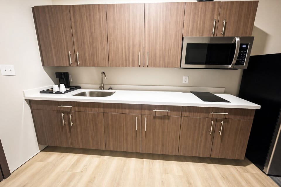 Prep quick bites on clean counters with modern appliances nearby.