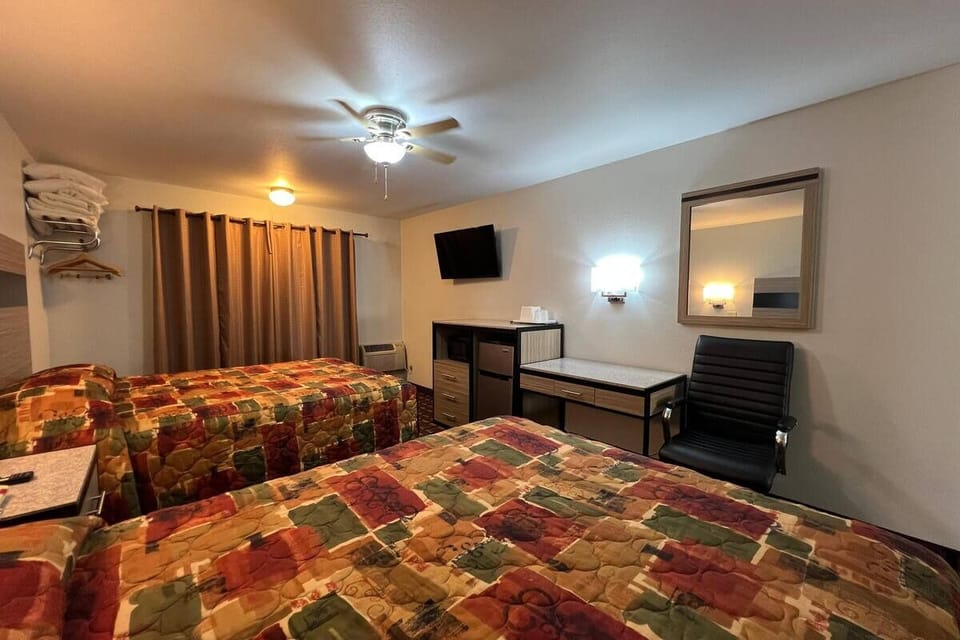 Kick back after adventures with TV, desk, and comfy beds.