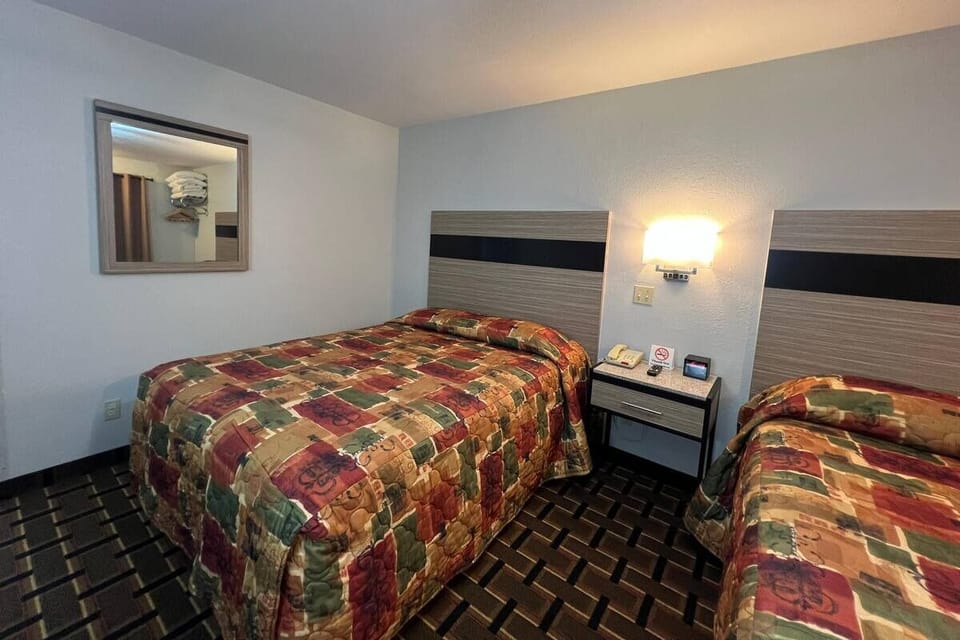 Drift off easily in plush beds with warm bedside glow.