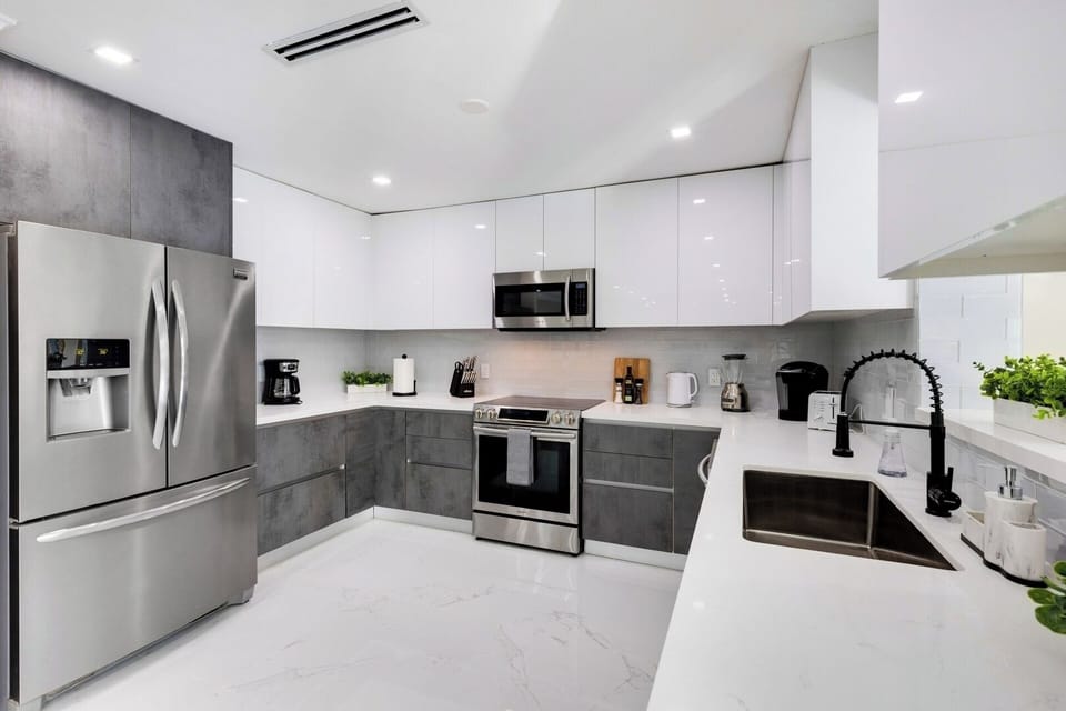 Enjoy your brand new kitchen with all-stainless steel appliances, sleek custom cabinets and beautiful tile floors.