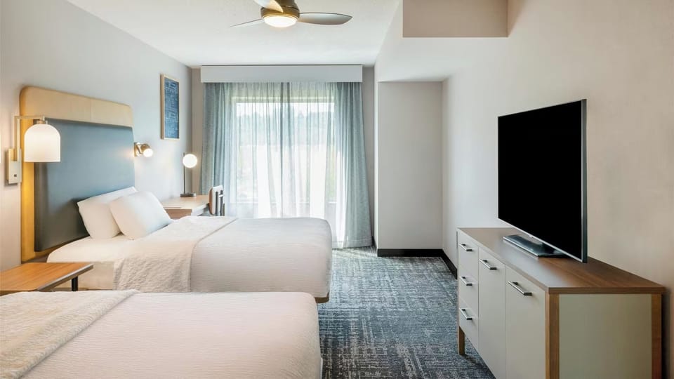 Unwind in a bright, spacious room with two cozy beds.