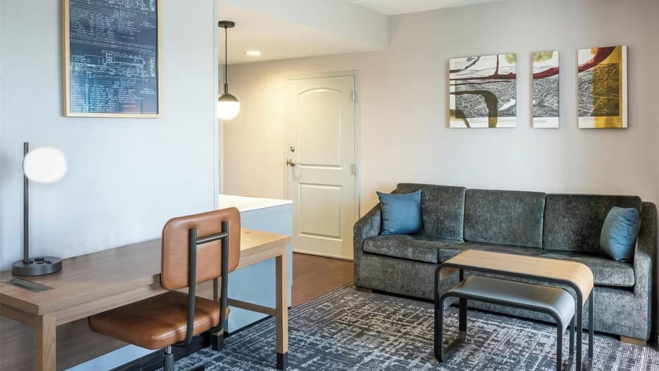Settle in and focus at a dedicated desk near the lounge.