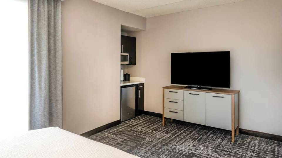 Kick back with big-screen TV and convenient in-room snacks.