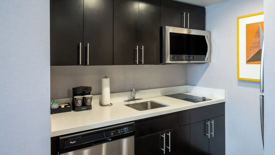 Prep easy meals with sleek appliances and crisp counters.