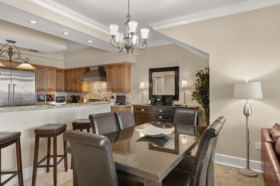Gather around your elegant dining table or relax at the kitchen bar in this open-concept space with rich granite counters.