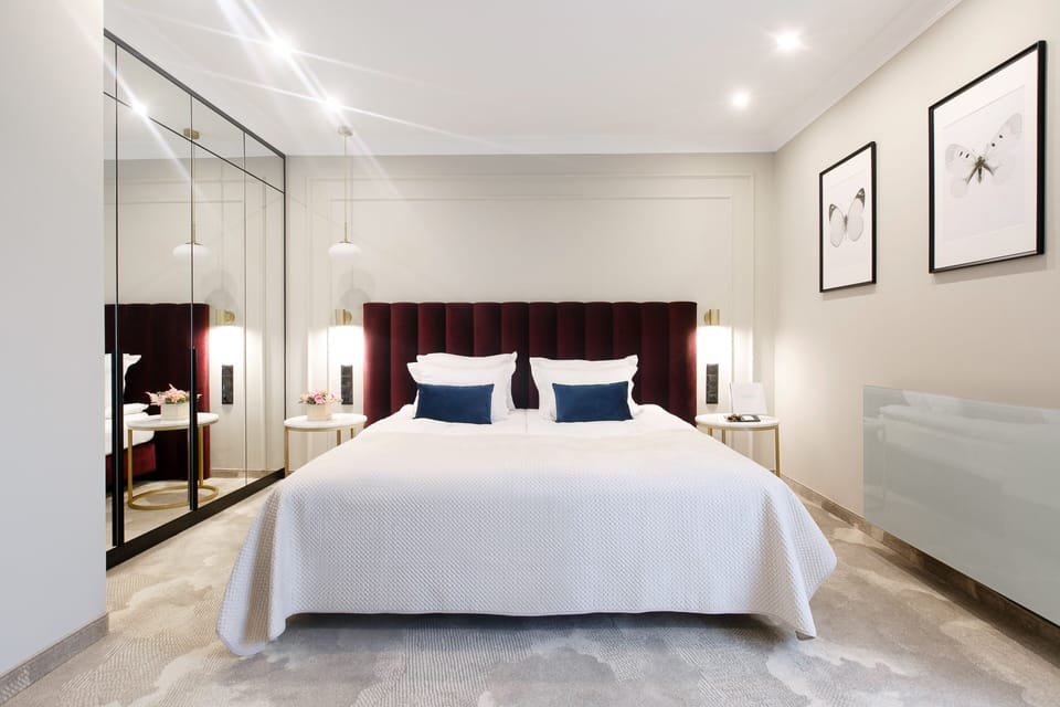 Sink into a plush king bed under soft designer lighting.