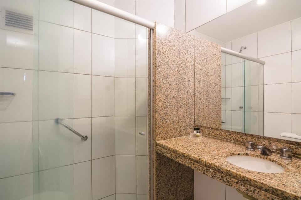 Refresh easily in a bright shower with granite vanity.