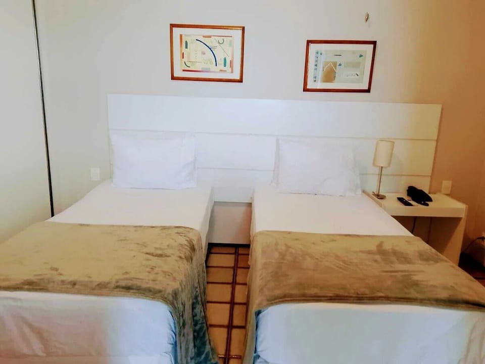 Settle into twin beds for a restful night’s sleep.