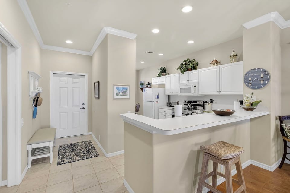 Open-concept space where kitchen flows into the entryway.ur stay.