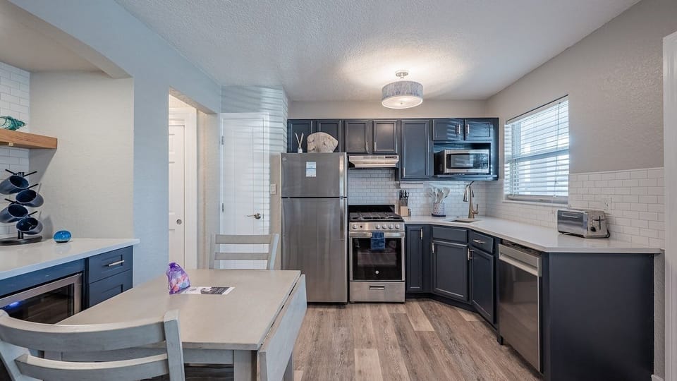 Cook easy meals in the sleek kitchen with modern appliances.