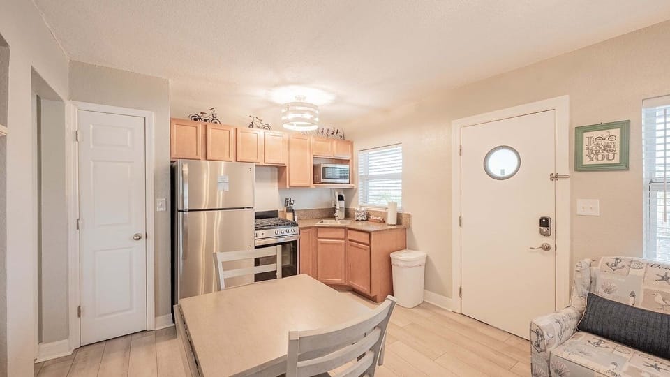 Enjoy simple dining moments steps from the compact kitchen.