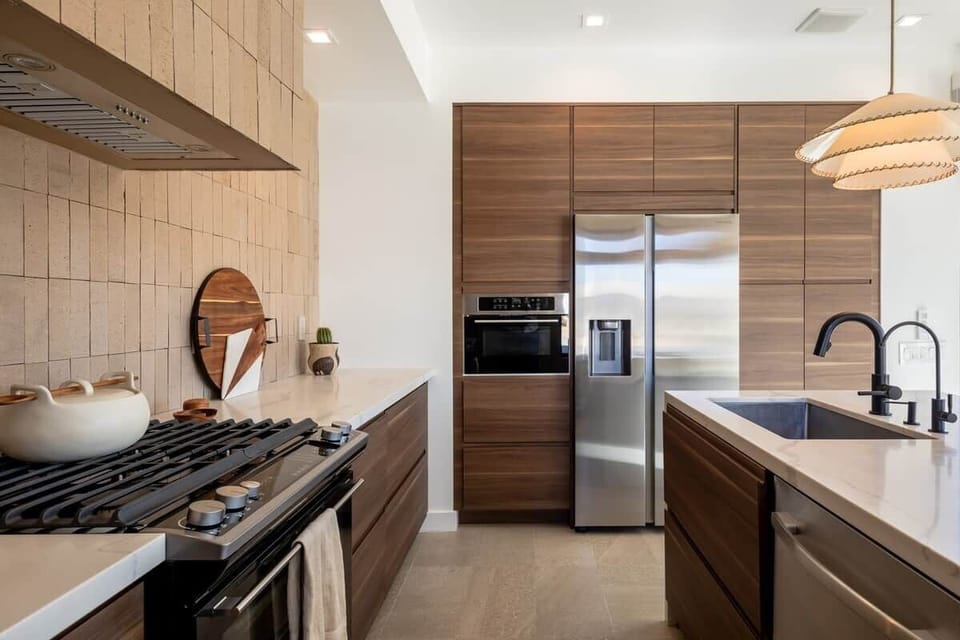 Kitchen concealed exhaust hood and filtered water for your comfort and healthy hydration needs.