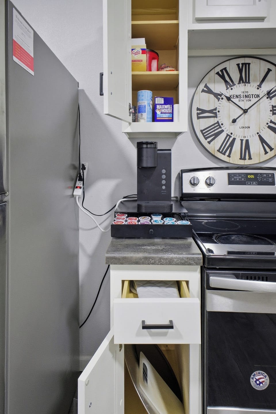 Cozy kitchen with Keurig + pods, stainless range, and organized storage.