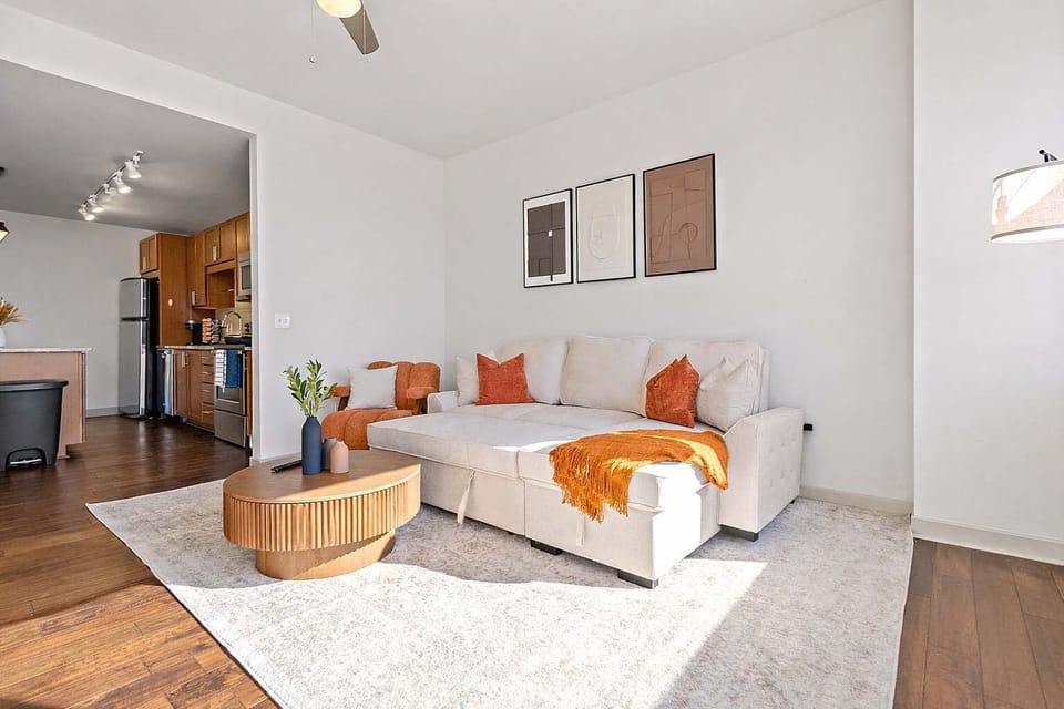 Kick back in a thoughtfully styled living room featuring warm tones, soft textures, and a relaxed layout. Great for reading, watching TV, or simply enjoying a comfortable space that feels welcoming and easy to settle into.