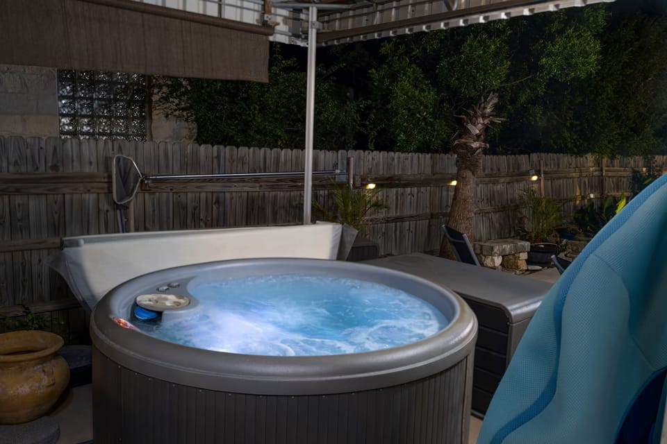 Hot tub area is covered so you may comfortable us in any weather. Totally private. Ceiling fan for use on hot summer nights Hot tub is clean, heated and ready for use all year round. Professionally maintained weekly.