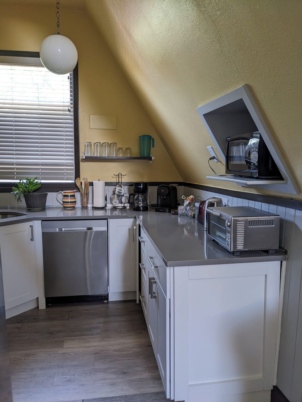 Kitchen. Toaster oven, electric kettle, toaster, plates, utensils, cookware