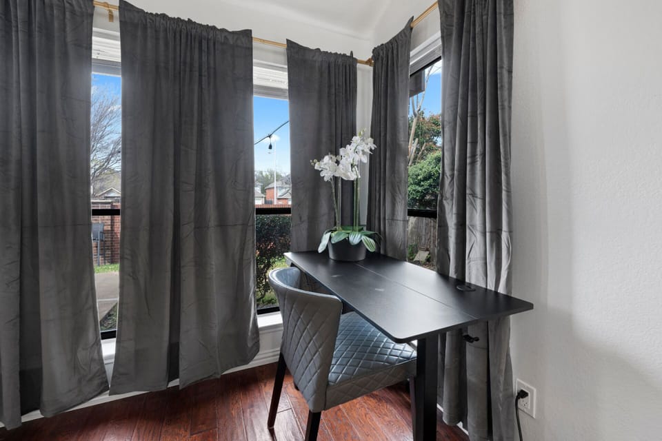 A quiet window-side workspace offers a bright spot to catch up on emails, plan your Dallas outings, or check the latest FIFA World Cup scores. ⚽