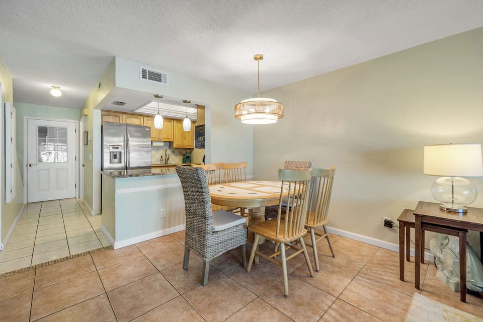 The dining room is conveniently located right next to the kitchen, creating an easy and functional space for meals and gatherings