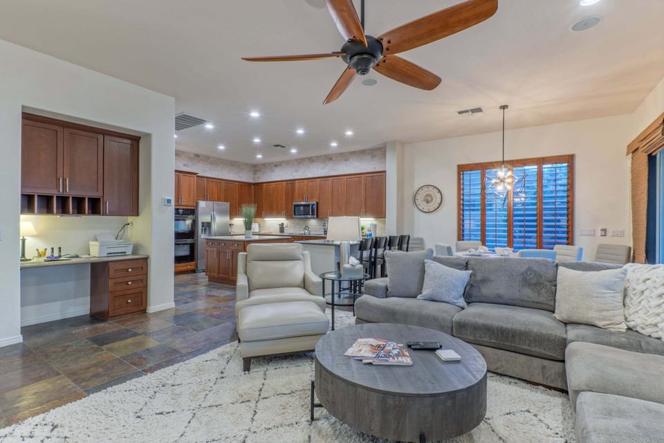 The open concept great room has a working station for your remote work and comfortable seating.