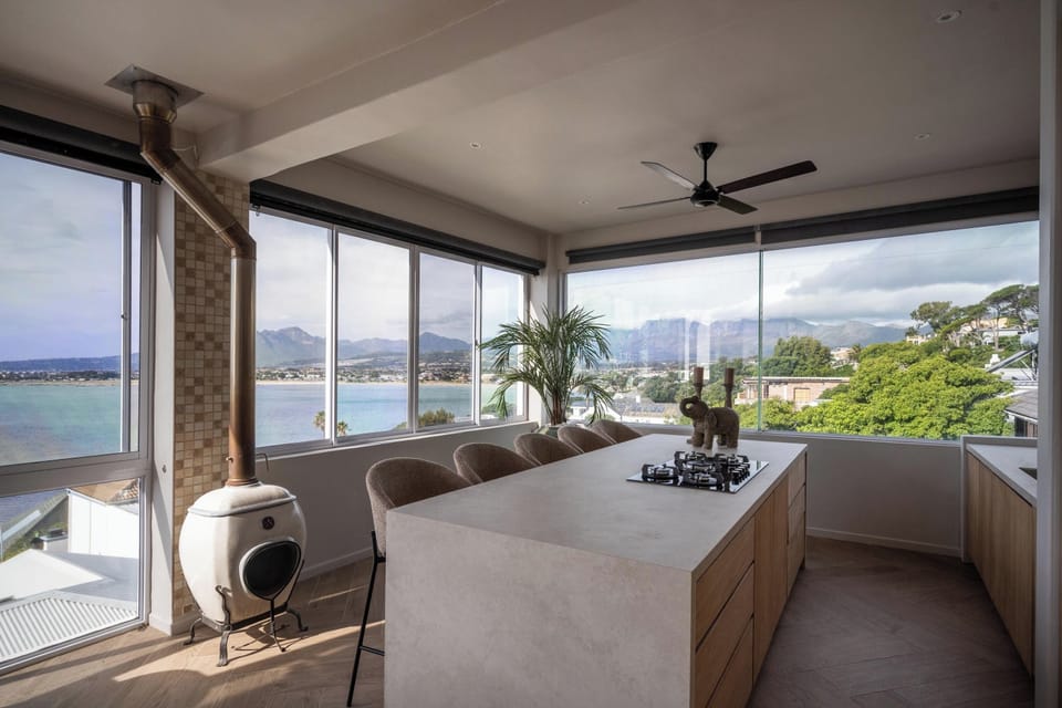 The kitchen with a beautiful view of the ocean and Gordons Bay