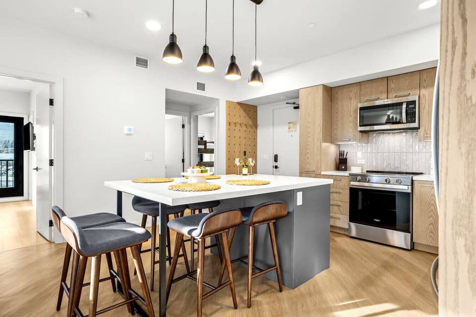 A fully equipped kitchen featuring a spacious counter area perfect for meal preparation.