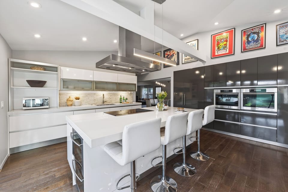 Bright, open kitchen designed for easy hosting, with seamless flow to indoor and outdoor gathering spaces.