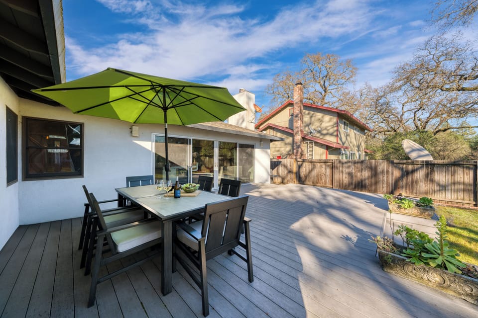 Private deck set for outdoor dining, perfect for easy mornings and laid-back evenings at home.