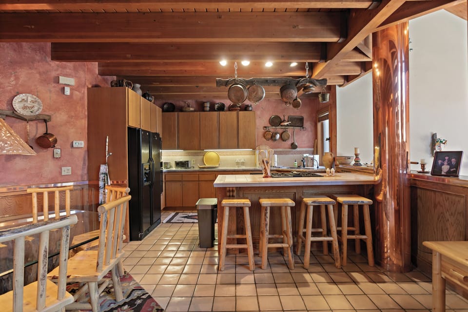 The rustic kitchen is the perfect backdrop for your culinary adventures.