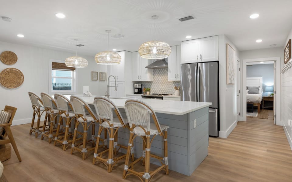 Your spacious chef's kitchen features modern appliances and a large island with seating for eight, perfect for memorable group meals.