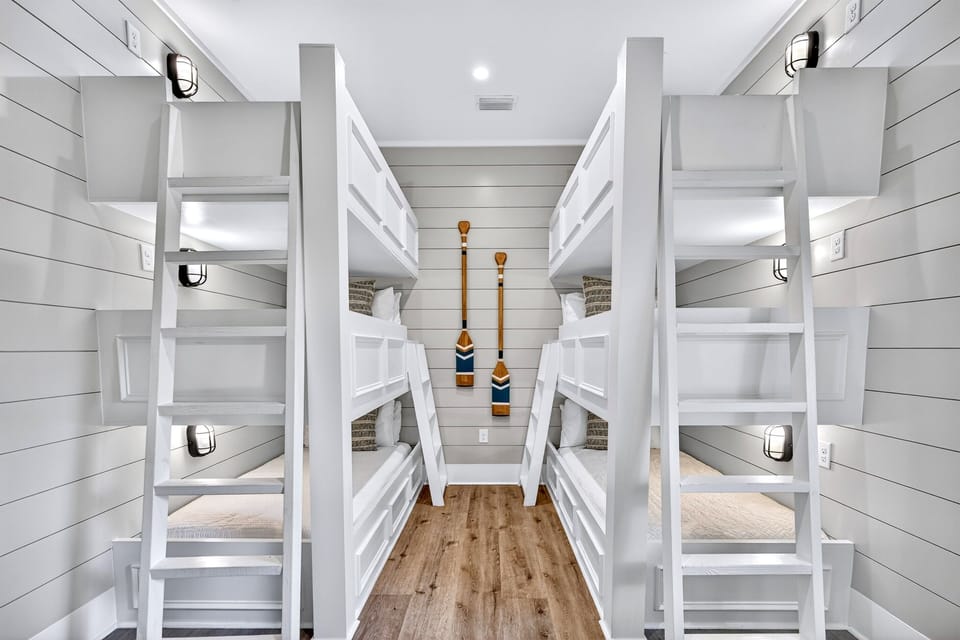 1st floor - Custom bunk room featuring 6 built-in twin beds and a private en-suite bathroom—perfect for kids and teens, with thoughtful design that maximizes space, comfort, and fun during your Miramar Beach getaway.