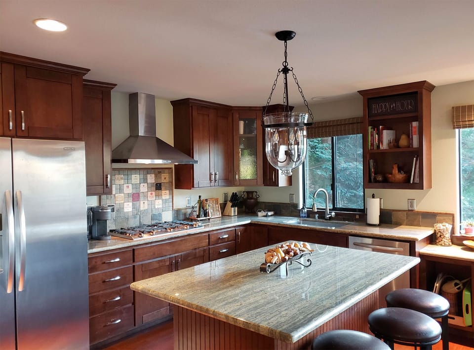 Your gourmet kitchen awaits with granite counters, wood cabinets, and modern appliances—perfect for cooking memorable meals together.