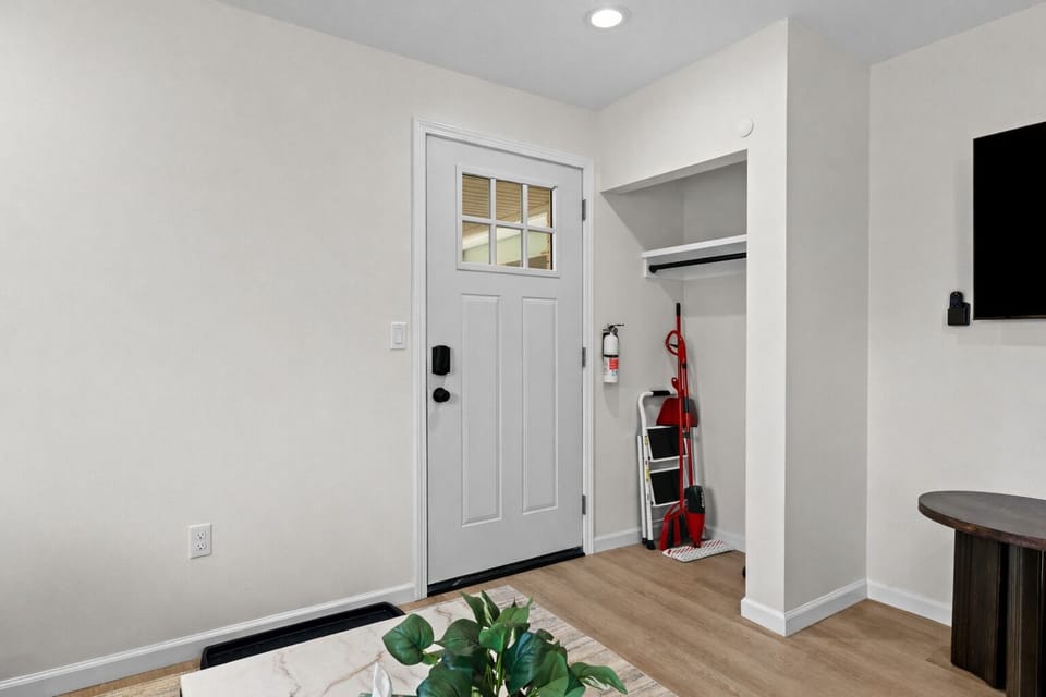 Clean, welcoming entryway with modern finishes, smart lock access, and convenient storage—making arrivals smooth, organized, and stress-free.
