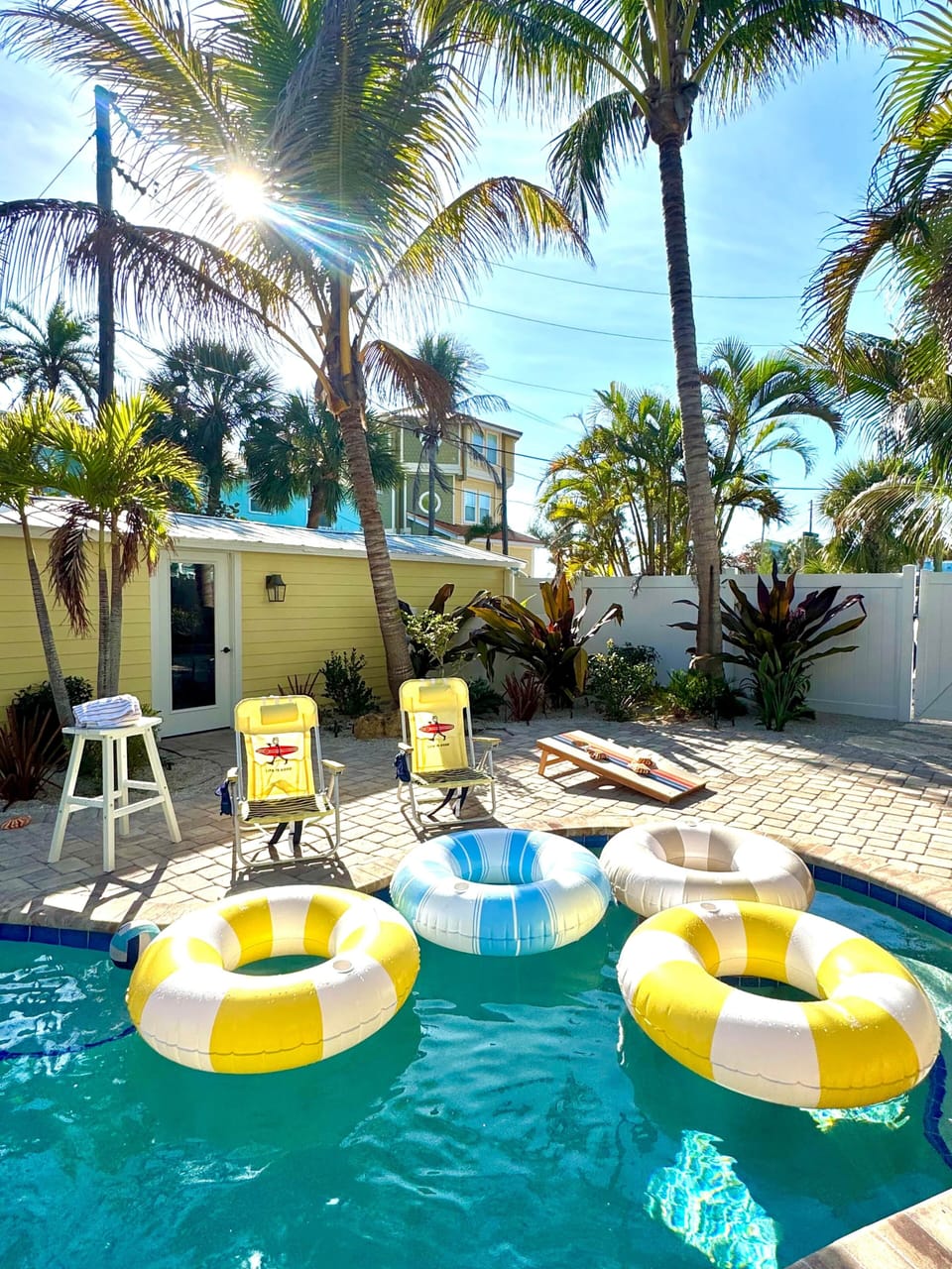Eight beach chairs & pool floats. 