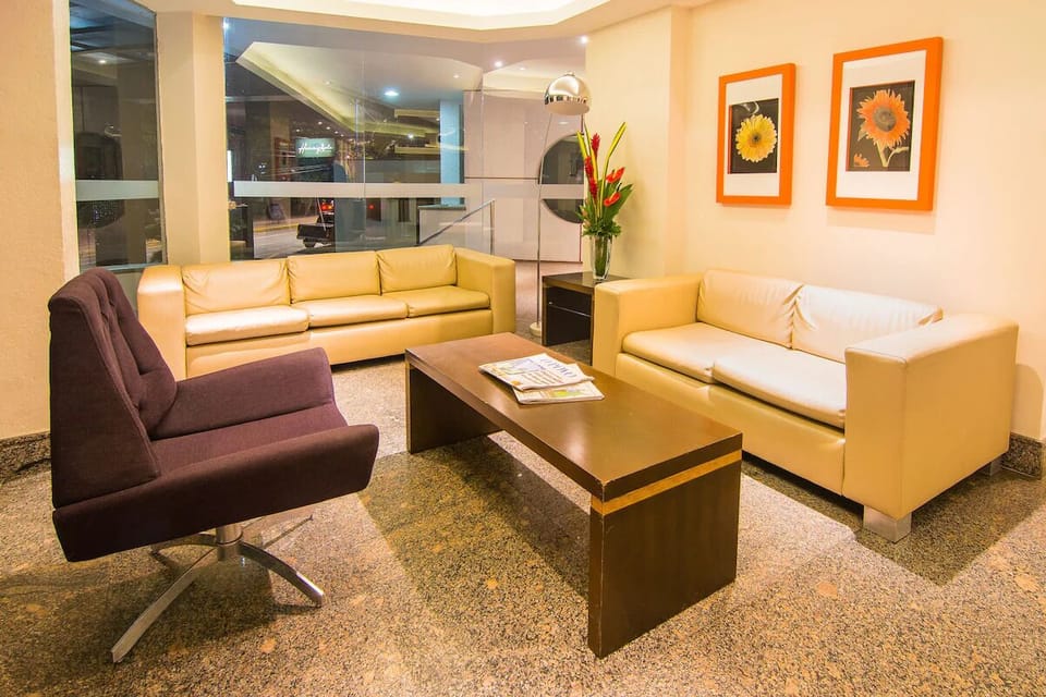 Unwind on plush sofas in a bright, stylish lounge.