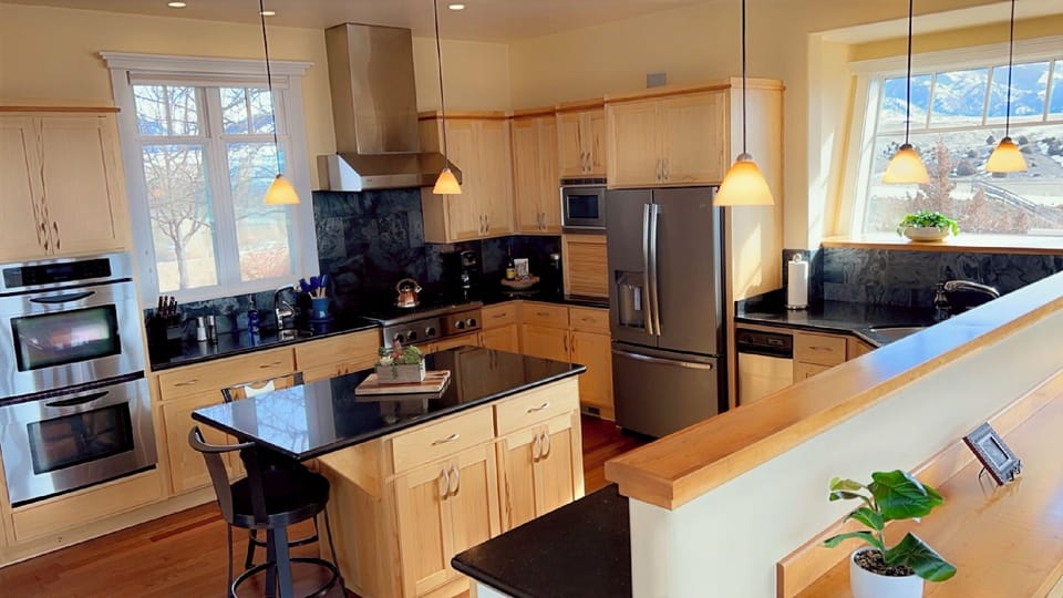 A cook's dream kitchen with plenty of large and small appliances.