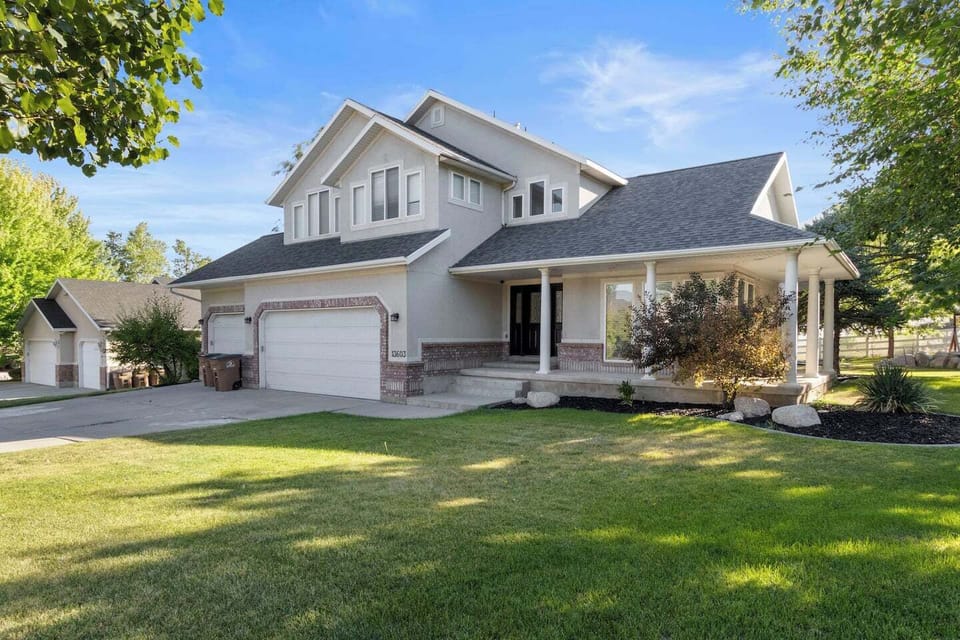 Large home in upscale neighborhood with wrap around front porch ideal for just sitting and relaxing in quite cul de sac.