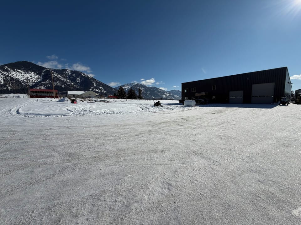 Flat driveway with plenty of parking.