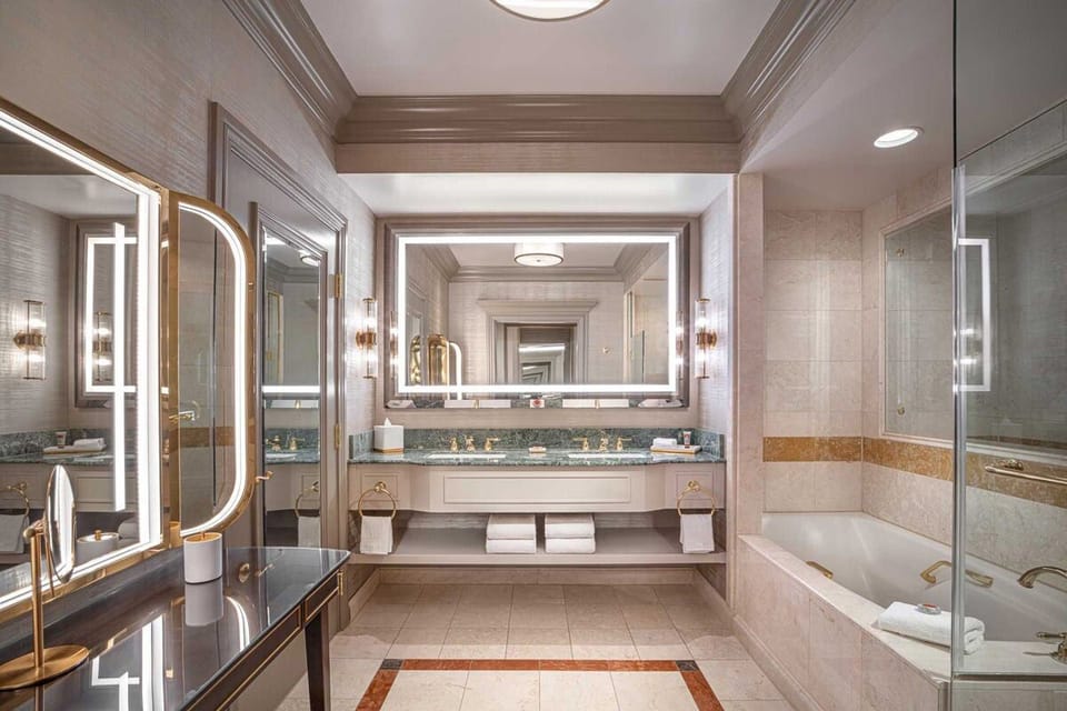 Refresh in a spa-like marble bath with deep soaking tub.
