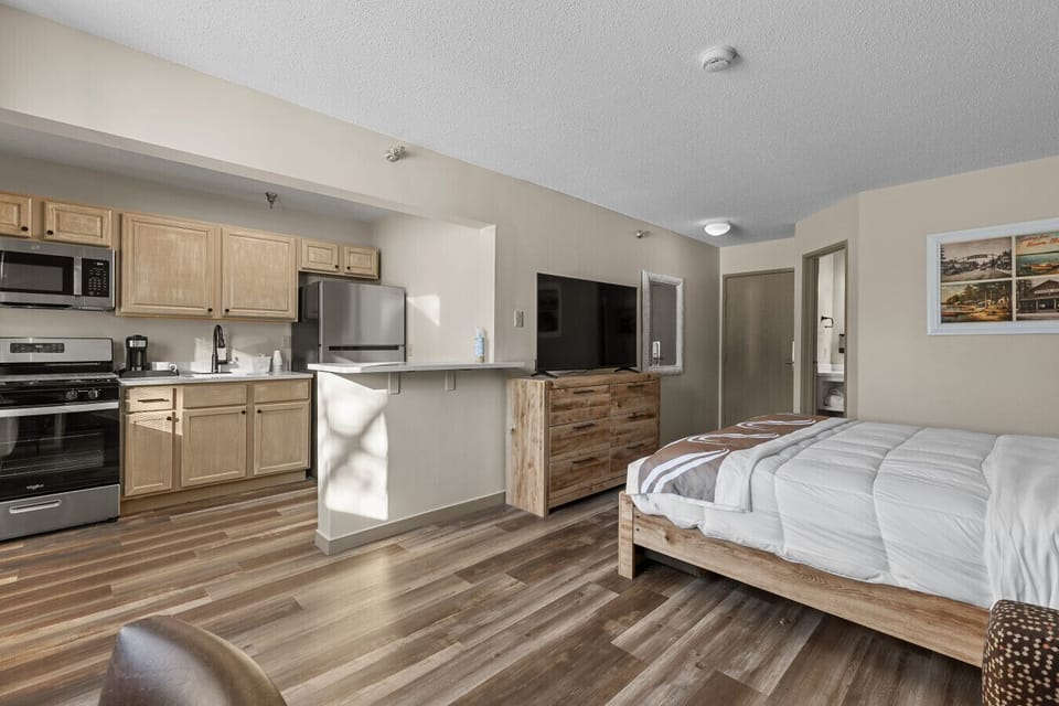 Full kitchen with breakfast bar and modern appliances