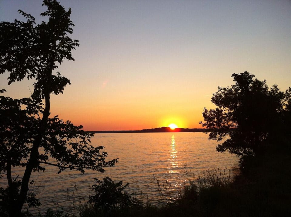 Scenic Gull Lake sunsets offering stunning views from nearby docks.
