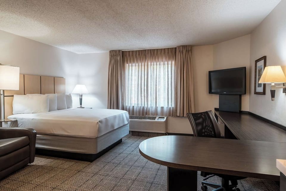 Stretch out in a spacious room with desk and daylight.